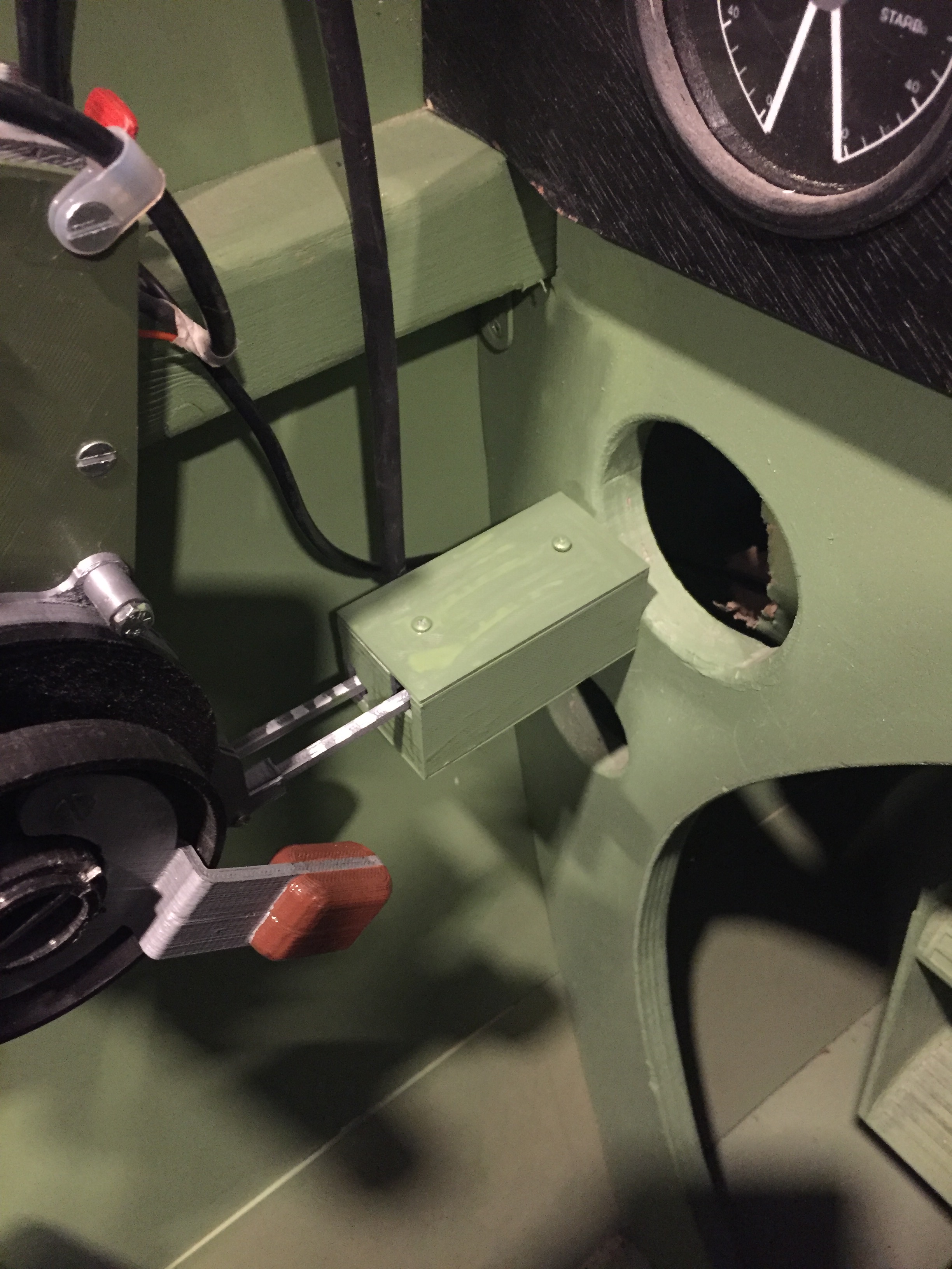 Photo shows the installation of the slider bow in the authors Spitfire simpit. The red tab visible top left is the WEP lever.